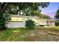 Charming ranch house with white exterior and landscaping at 905 14Th Ne St, Winter Haven, FL 33881