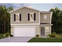 Two-story home with attached garage and landscaping at 989 Ambleside Dr, Haines City, FL 33844