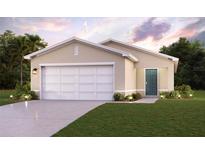 Two-car garage and front yard landscaping at 1021 Ambleside Dr, Haines City, FL 33844