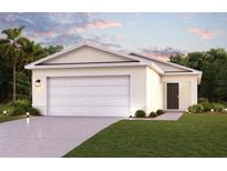 Two-car garage and front yard landscaping at 2211 Majestic Span Ave, Eagle Lake, FL 33839