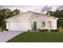Single-story home with two-car garage and landscaped front yard at 429 Baltic Ct, Poinciana, FL 34759
