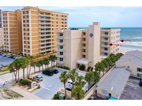 Oceanfront condo building with parking and beach access at 3801 S Atlantic Ave # 303, Daytona Beach Shores, FL 32118