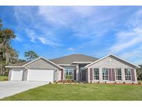 Beautiful two story home with a three car garage at 200 Lagoon Mist Court, Oak Hill, FL 32759