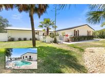 Newly renovated home with a modern exterior and a private pool at 3120 John Anderson Dr, Ormond Beach, FL 32176