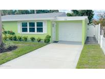 Charming light green house with a one car garage at 54 Palmetto Dr, Ormond Beach, FL 32176