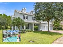 Two story house with a pool and landscaped yard at 28 Dormer Dr, Ormond Beach, FL 32174