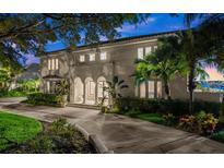 Beautiful waterfront home with lush landscaping at 70 Riverside Dr, Ormond Beach, FL 32176