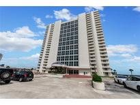 High-rise building exterior showcasing modern architecture and ample parking at 2545 S Atlantic Ave # 1701, Daytona Beach Shores, FL 32118