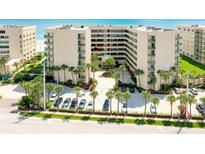 Oceanfront building, aerial view showing parking and landscaping at 4555 S Atlantic Ave # 4304, Ponce Inlet, FL 32127