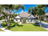Single-story home with landscaped yard and driveway at 10 Whitehall Ct, Flagler Beach, FL 32136
