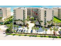 Oceanfront condo building with parking and tropical landscaping at 4565 S Atlantic Ave # 5308, Port Orange, FL 32127