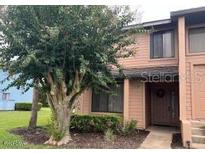 Two-story townhome with mature landscaping at 129 Blue Heron Dr # A, Daytona Beach, FL 32119