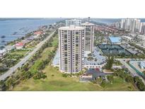 Aerial view of a luxurious condo building with ocean and city views at 1 Oceans West Blvd # 5B3, Daytona Beach, FL 32118