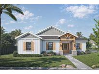 One-story farmhouse style home with white siding at 671 James Moore Dr, Mount Dora, FL 32757