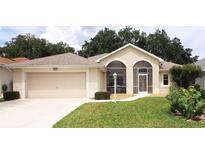 Single-story house with attached garage and screened porch at 4953 Glen Coe St, Leesburg, FL 34748