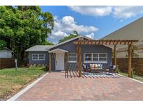 Newly renovated home with pergola and brick pavers at 1921 Dartmouth Ave, Winter Park, FL 32789