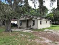 Single story home with covered porch at 1603 Rose Ln, Eustis, FL 32726