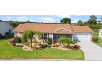 Well-maintained ranch home with attractive landscaping at 5845 Hickey Way, The Villages, FL 32163