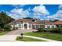 Single Gathering home with tile roof and 3-car garage at 8692 Crested Eagle Pl, Sanford, FL 32771