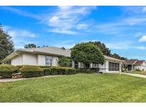 Single-story home with well-maintained lawn at 6435 Borg St, Leesburg, FL 34748