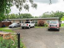 Brick ranch home with a spacious driveway at 1817 Demastus Ln, Ocoee, FL 34761