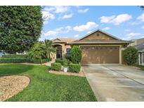 Single Gathering home with landscaped yard at 114 Compass Rose Dr, Groveland, FL 34736