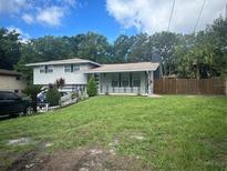 House exterior showcasing a well maintained lawn at 2524 Good Homes Rd, Orlando, FL 32818