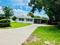 Newly renovated single story home with carport and well manicured lawn at 201 6Th Jpv St, Winter Haven, FL 33880