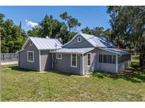 Aerial view showcasing the house's rear and side at 19402 E 5Th St, Umatilla, FL 32784