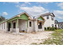 House under construction with block foundation and framing at 10607 Grand Oaks Blvd, Oxford, FL 34484