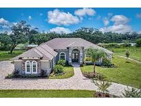 Luxury home with expansive grounds and stunning architectural features at 3457 Lake Diane Rd, Tavares, FL 32778