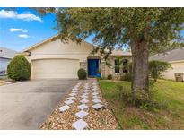 Quaint one-story home with stone accents at 30549 Pga Dr, Sorrento, FL 32776