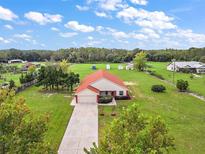 Single-story home on spacious lot with detached shed at 8222 Florida Boys Ranch Rd, Groveland, FL 34736