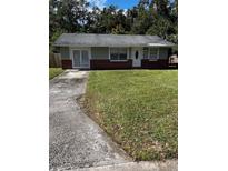 One-story house with gray siding and brick accents at 620 Gould St, Eustis, FL 32726