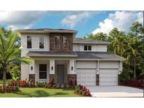 Two story home with two car garage and landscaping at 16144 Volterra Pt, Montverde, FL 34756