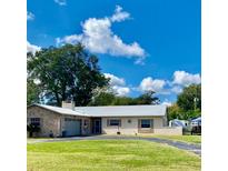 Ranch-style home with metal roof and mature landscaping at 508 Se 52Nd Ave, Ocala, FL 34471