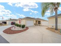 Single-Gathering home with attached garage and landscaped yard at 17126 Se 78Th Parlange Ter, The Villages, FL 32162