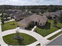 One-story home with a two-car garage and circular driveway at 1010 Nantucket Sound, Mount Dora, FL 32757
