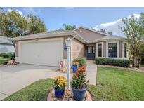 Well-maintained house with a landscaped yard at 3332 Flagship Ave, Tavares, FL 32778