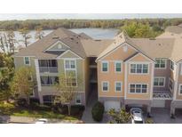 Two-story building with lakefront views and parking at 3406 Soho St # 102, Orlando, FL 32835