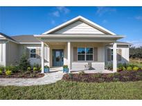 Charming one-story home with a covered porch at 38805 Ranch Gate Blvd, Umatilla, FL 32784