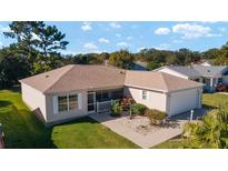 Cute one-story home with attached garage and landscaped yard at 8540 Se 177Th Bartram Loop, The Villages, FL 32162