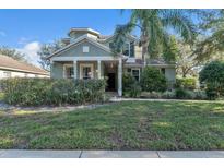 Two story house exterior, front yard, and landscaping at 929 Magnolia Blossom Ct, Apopka, FL 32712
