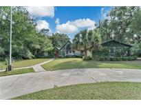 Ranch style home with mature landscaping and circular driveway at 4626 Ne 7Th St, Ocala, FL 34470