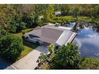 Single-Gathering home on the lake with a dock at 13724 Country Club Dr, Tavares, FL 32778