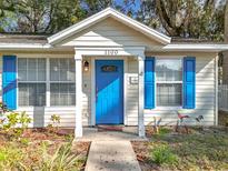 Charming house with blue shutters and white picket fence at 1100 N Grandview St, Mount Dora, FL 32757