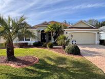 Attractive one-story home with landscaped yard and two-car garage at 752 Maybank Loop, The Villages, FL 32162