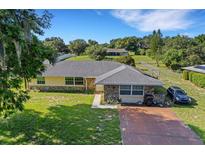 Single-Gathering home with stone exterior and driveway at 40 Britton St, Babson Park, FL 33827