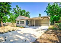 Charming house with covered carport and landscaped yard at 318 Senate St, Auburndale, FL 33823
