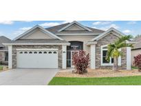 Stunning two-story home with stone accents at 8288 Lake James Dr, Lakeland, FL 33810